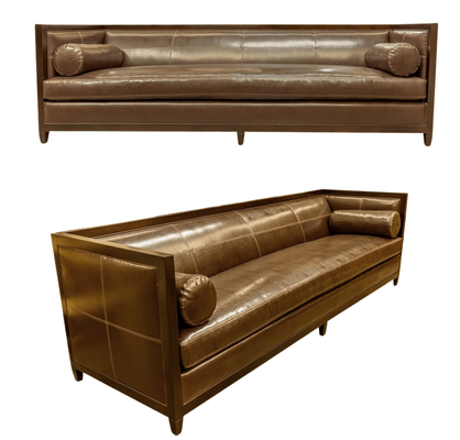 Two views of a brown leather sofa with bolster pillows.