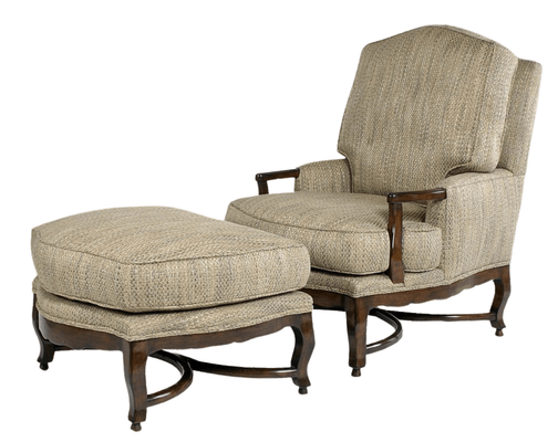 Beige upholstered armchair with matching ottoman, dark wood frame.