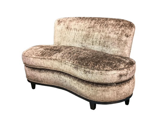 Curved vintage loveseat upholstered in mottled brown fabric, black legs.
