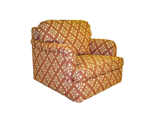 Armchair with diamond pattern upholstery in red and cream.