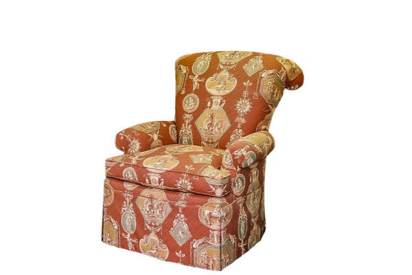 Red patterned armchair with rolled arms and back.