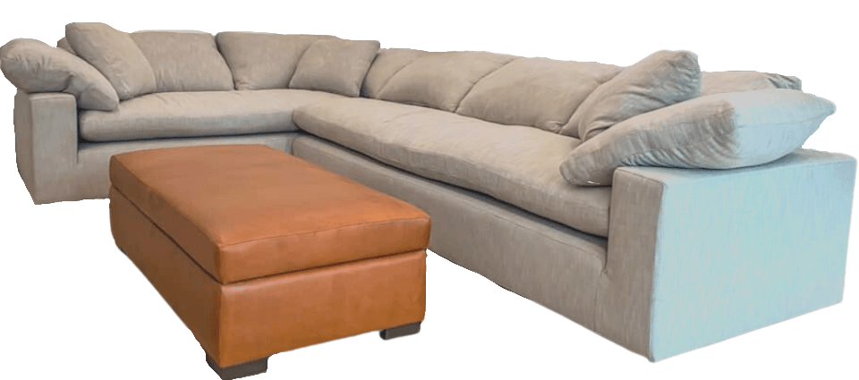 L-shaped beige sectional sofa with brown ottoman. White background.