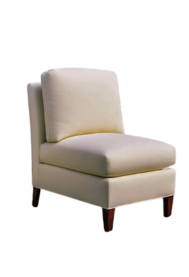 Cream-colored upholstered armless chair with a rectangular back cushion and dark wooden legs.