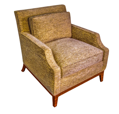Tan upholstered armchair with wooden legs.
