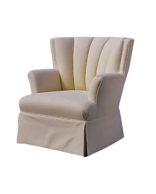 Cream-colored upholstered armchair with a pleated back and skirt.