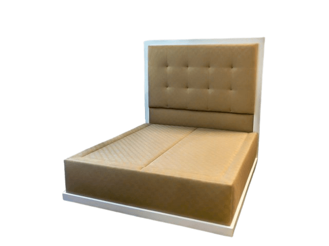 Tan upholstered bed with a button-tufted headboard, set in a white frame.