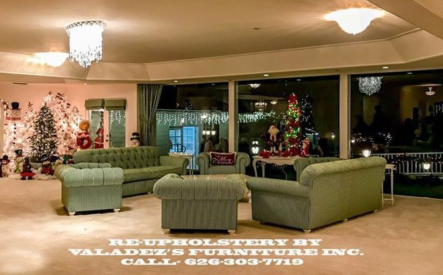 Green upholstered furniture in a room with Christmas decorations. Valadez's Furniture Inc. re-upholstery services.