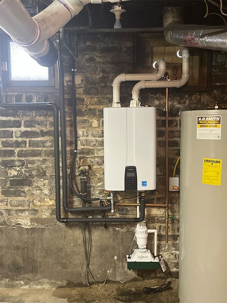 Wall-mounted boiler with pipes beside a water heater in a basement utility room