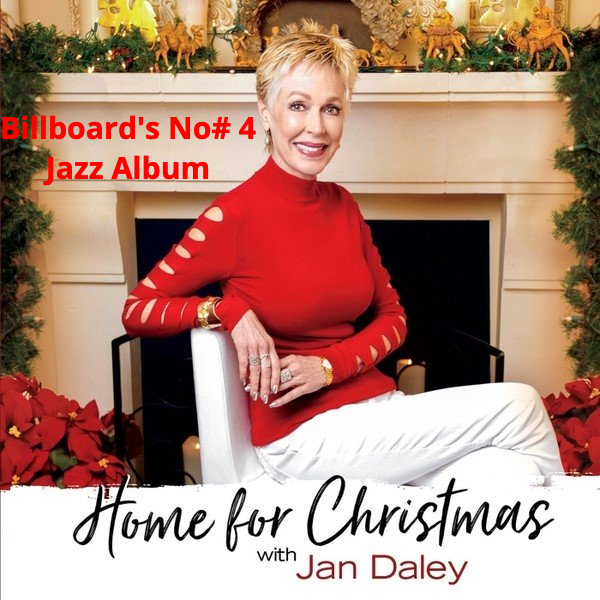 A woman in a red sweater sits in front of a fireplace on the cover of home for christmas