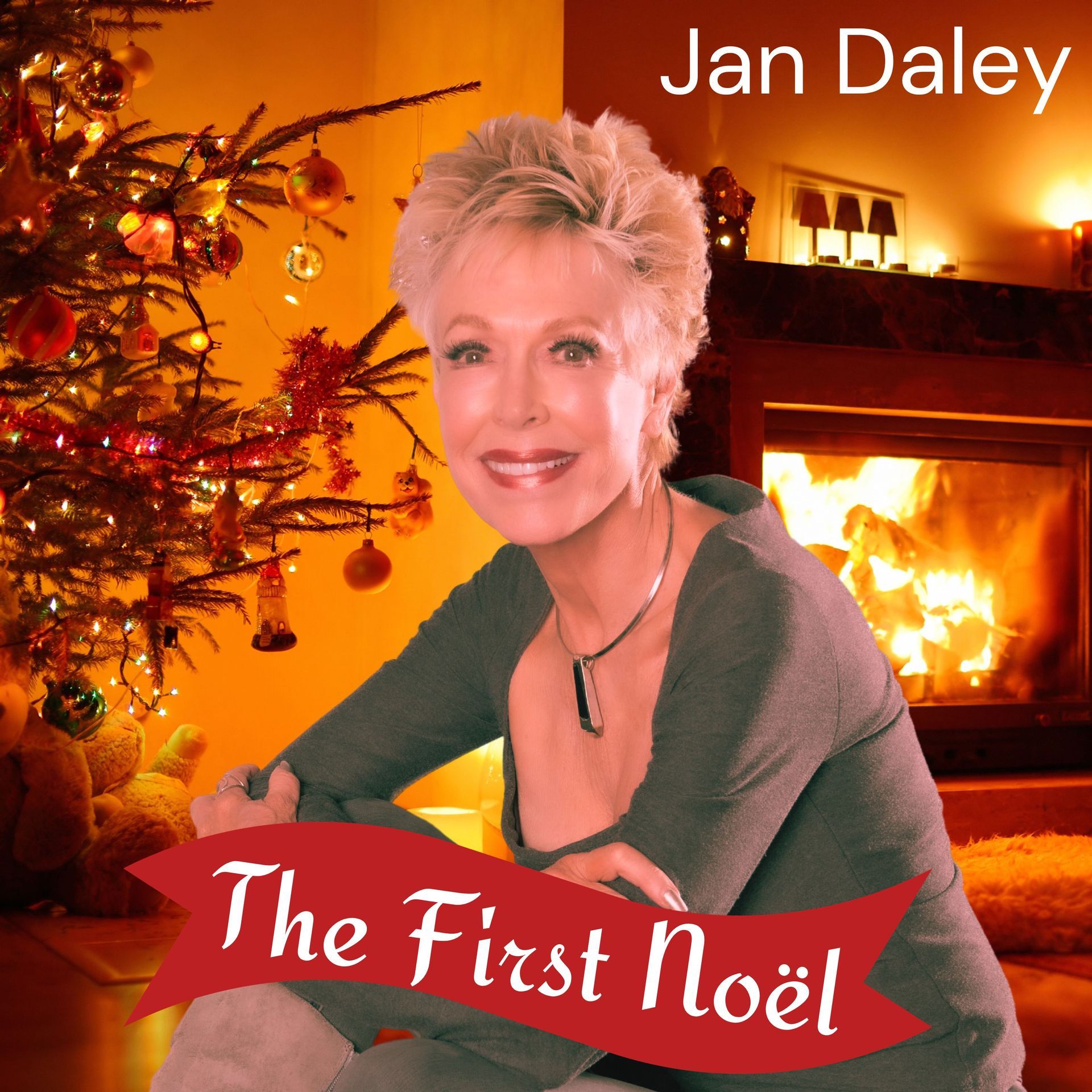 A picture of a woman sitting in front of a christmas tree with the title the first noel