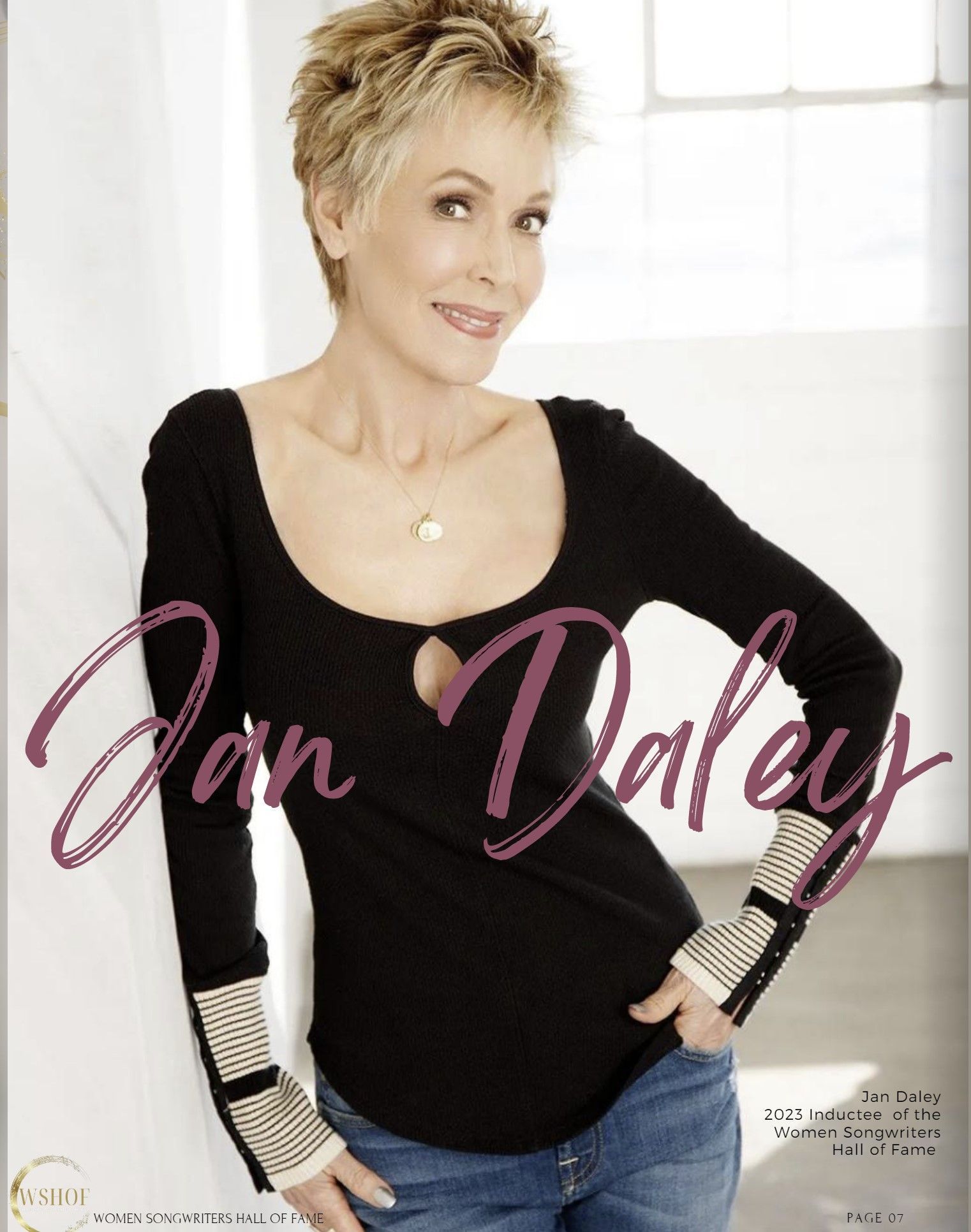 A woman in a black shirt with the name jan daley on it