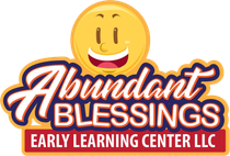 The logo for abundant blessings early learning center llc has a smiley face on it.