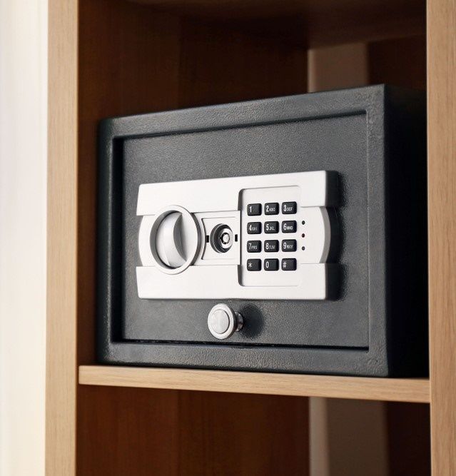 A Digital Safe Is Sitting On Top Of A Wooden Shelf — Locksolid Security Locksmiths in Grafton, NSW