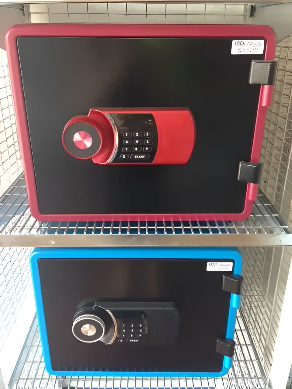 Two Safes Are Stacked On Top Of Each Other On A Shelf — Locksolid Security Locksmiths in Grafton, NSW