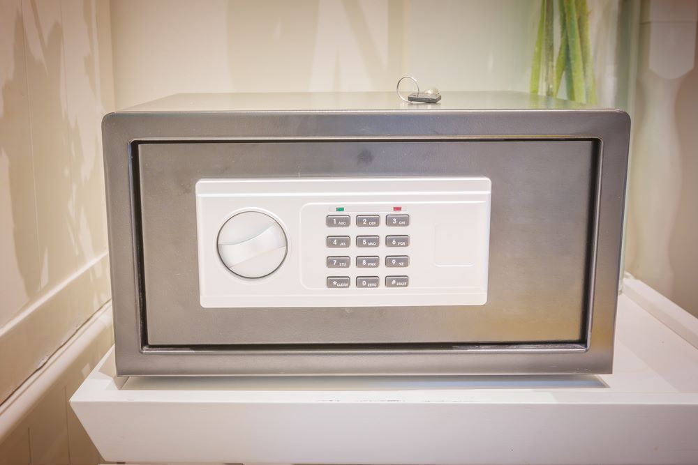 A Stainless Steel Safe Is Sitting On Top Of A White Table — Locksolid Security Locksmiths in Grafton, NSW