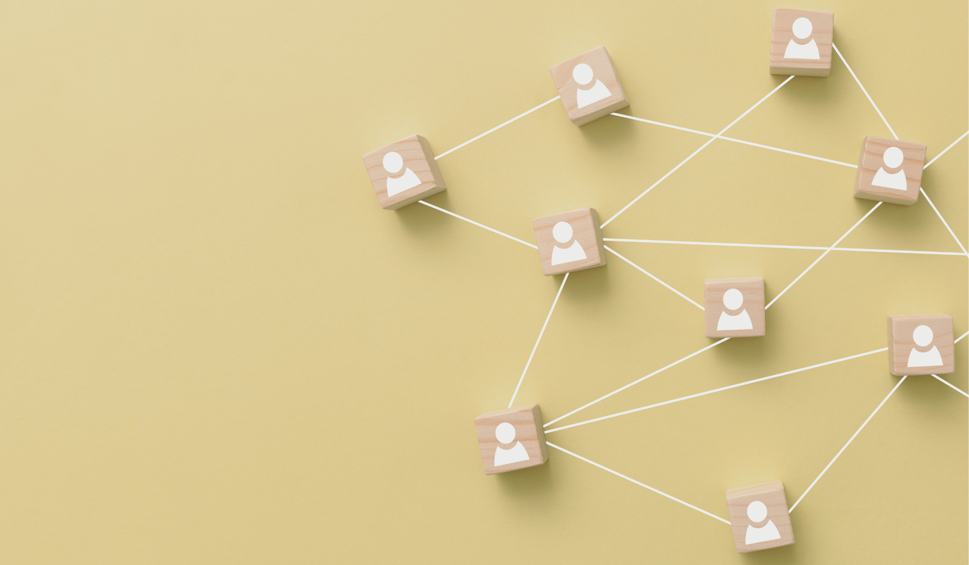 A group of wooden blocks with people on them are connected to each other on a yellow background.