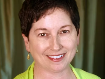 licensed massage therapist Susan Mathason smiles at the camera