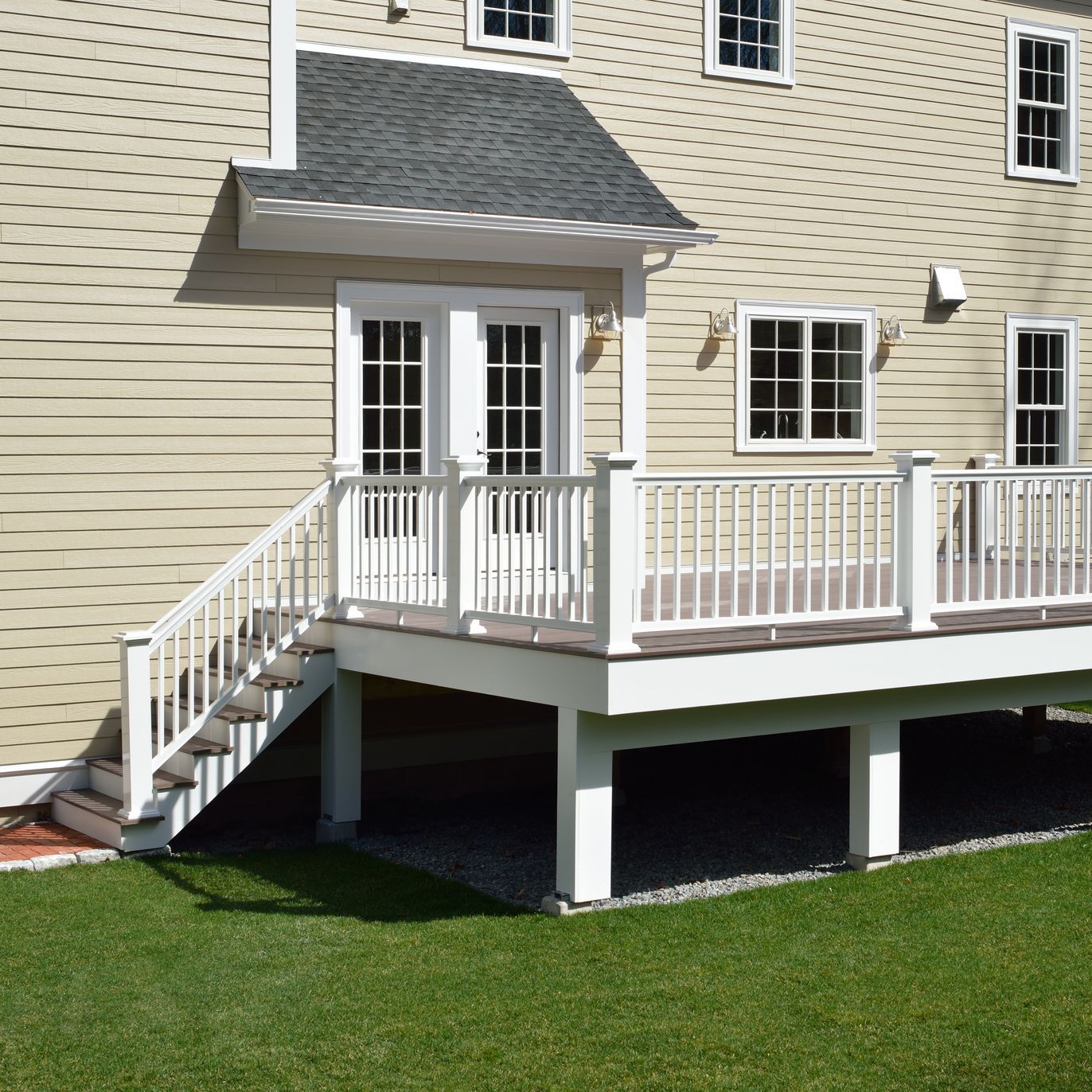 The back of a house with a deck and stairs