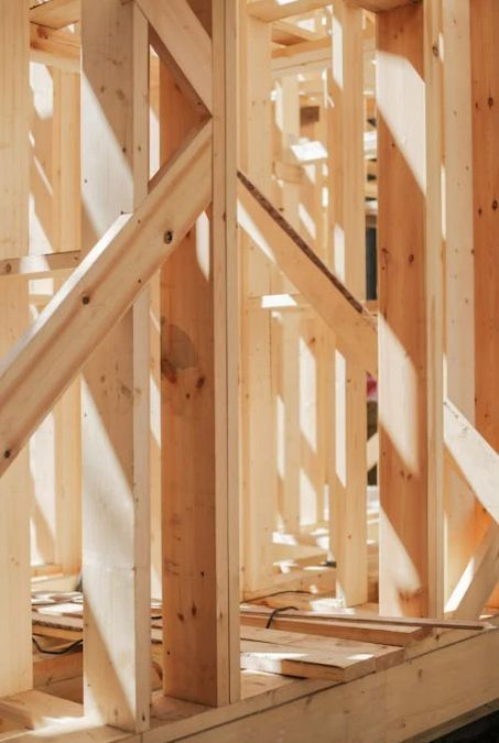 A close up of a wooden frame of a building under construction.