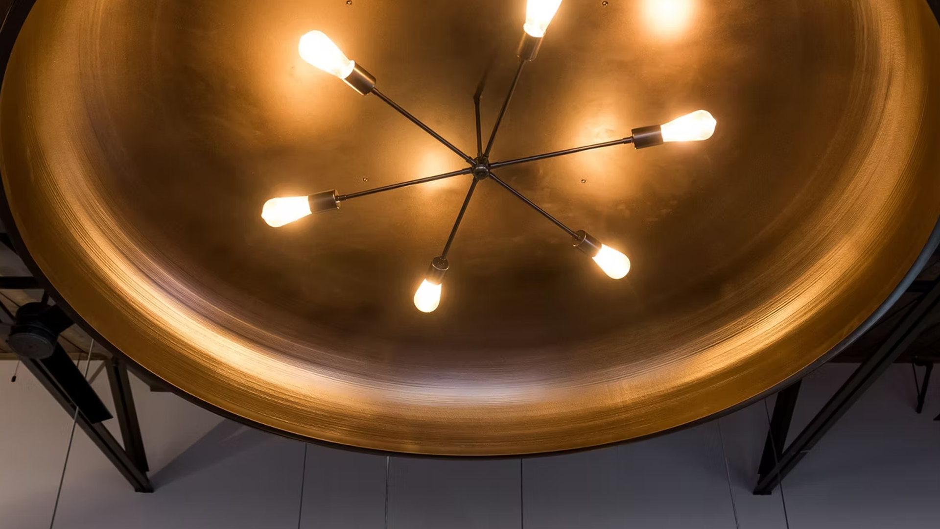 Gold dome ceiling with a sputnik-style light fixture, six bulbs lit.
