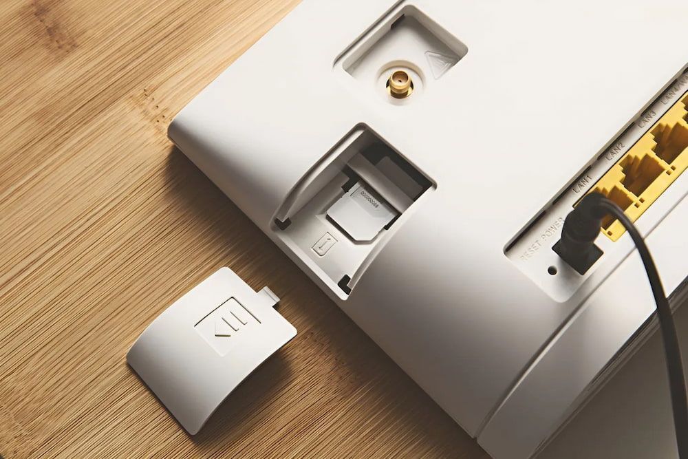 White Router Back Panel With Open Sim Card Slot and Ethernet Cable — Superior Wifi in Lismore, NSW