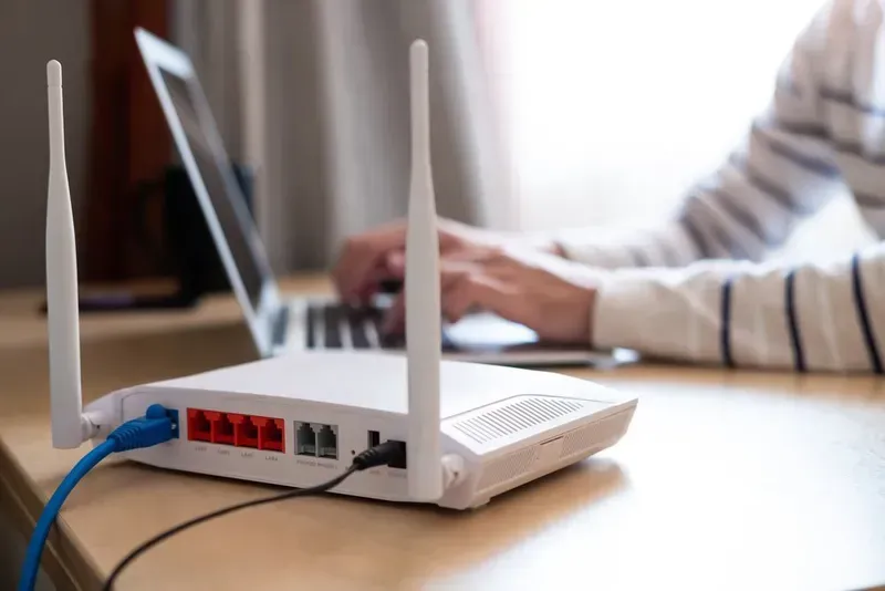 White Wi-fi Router With Antennas, Blue and Black Cables Connected — Superior Wifi in Lismore, NSW
