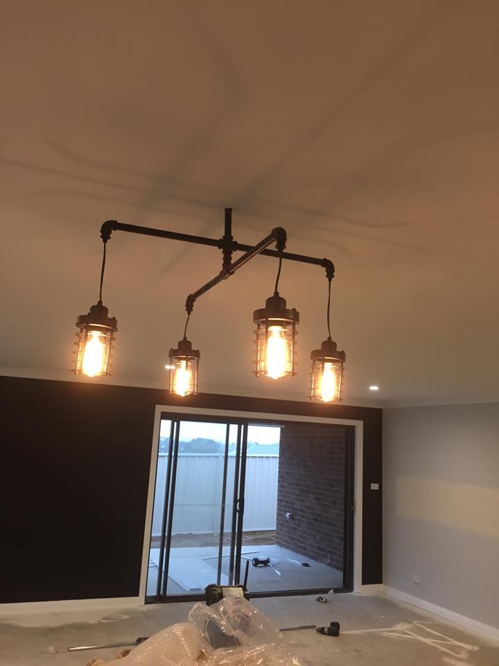 Exquisite New House Featuring Elegant Chandelier Lighting — Electrician in Central West