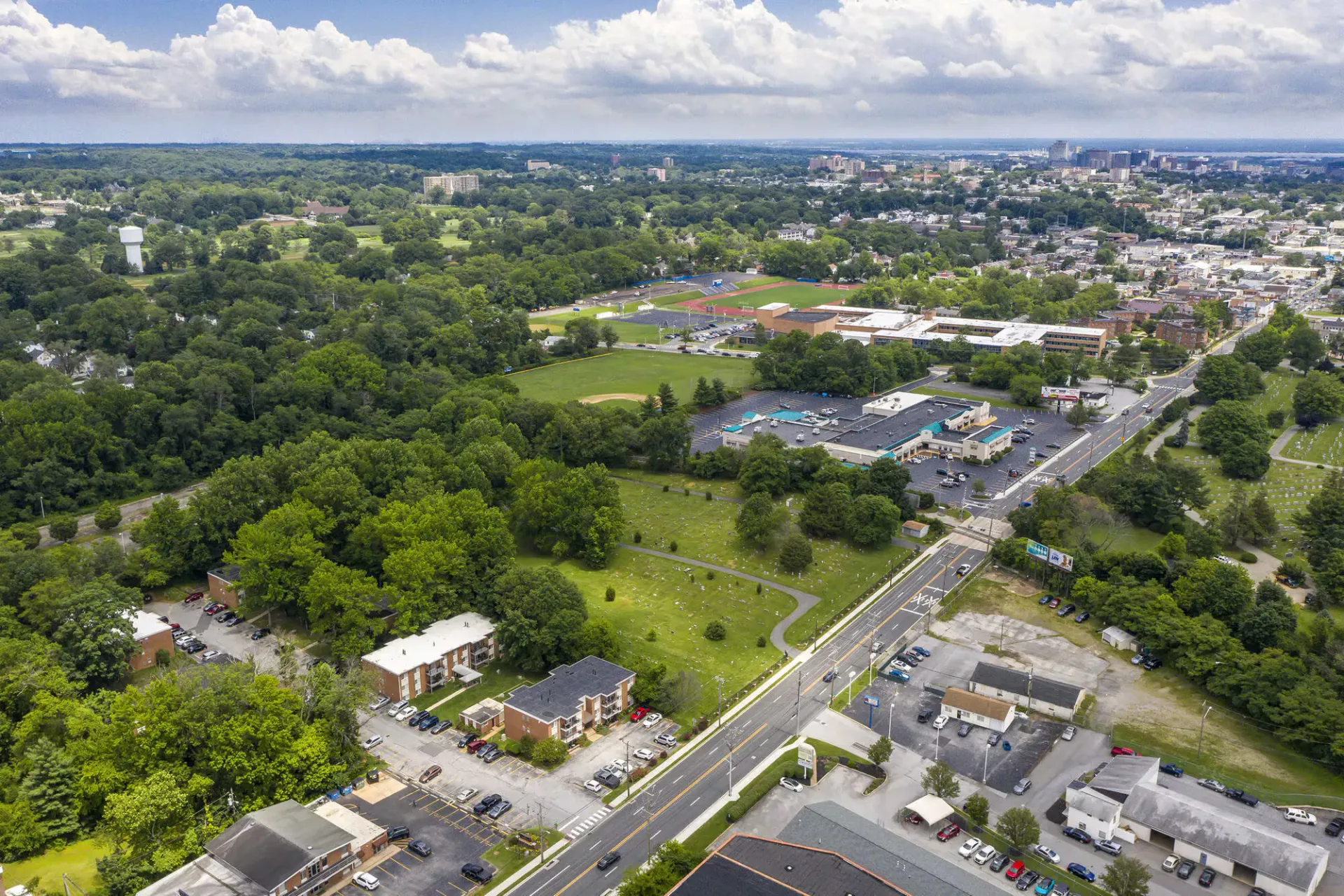 Aerial view of a large greenspace with a baseball field and surrounding roads in an urban area at Westover Pointe in Wilmington, DE.