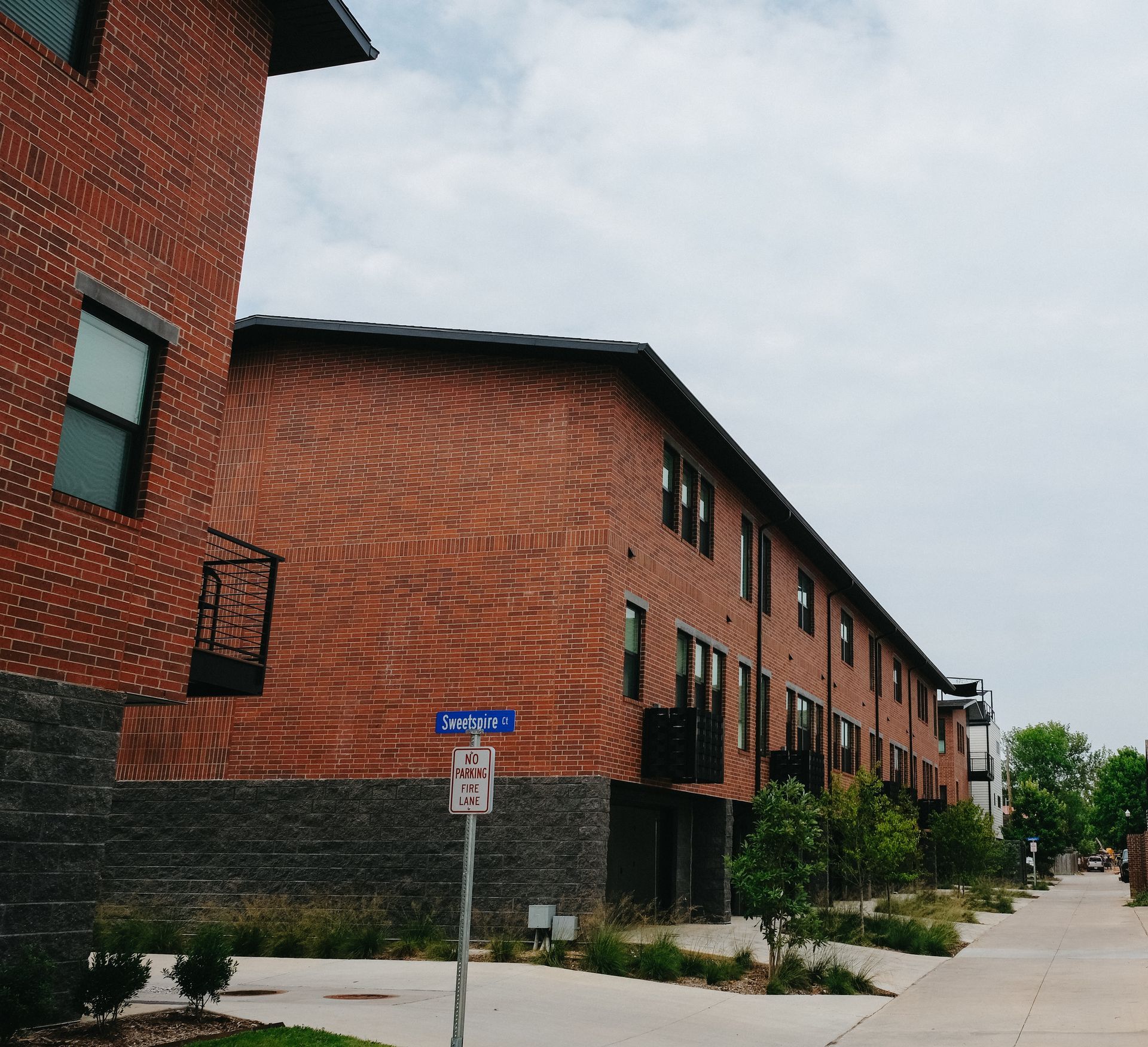 A brick building with a no parking sign in front of it