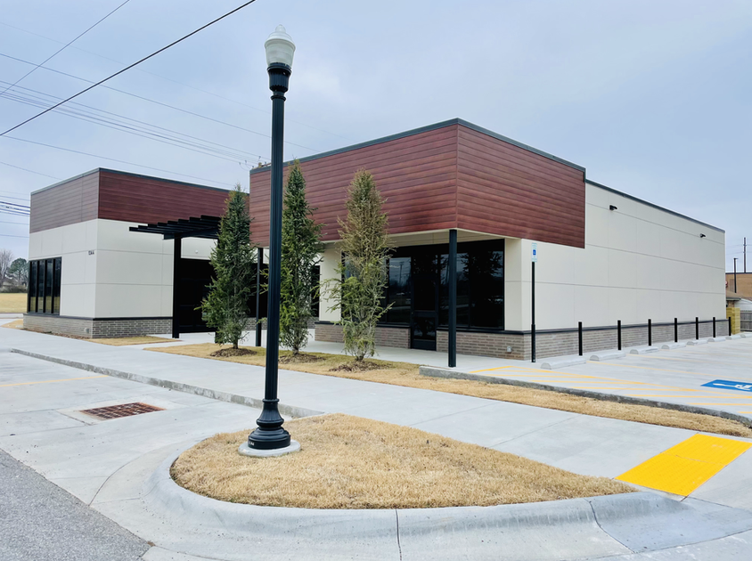 A building with a handicapped parking spot in front of it
