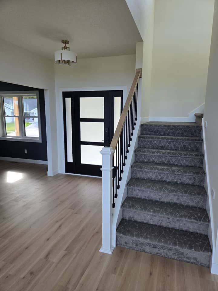 There is a staircase leading up to the second floor of a house.