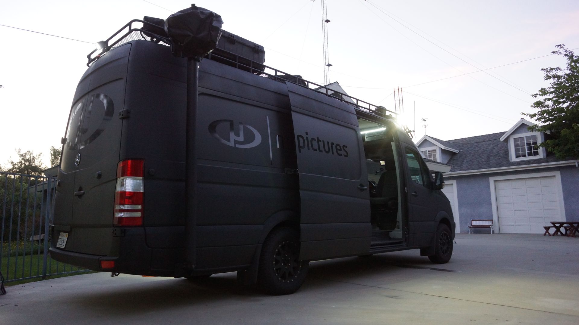 Exterior shot of the Tactical Mobile Workspace with its stealth armor, featuring a non-reflective flat black finish and textured LINE-X paint job for superior scratch resistance and stealth capabilities on film sets.