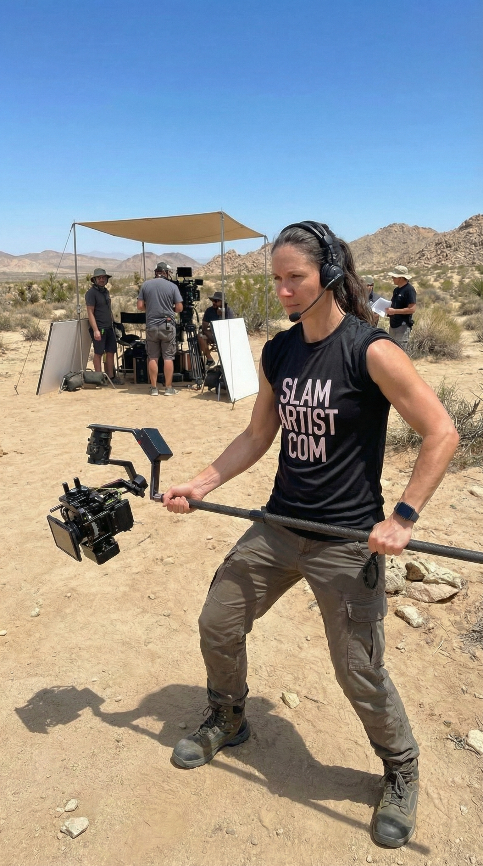 SlamArtist.com operator using HyperWarpCam® in an outdoor stunt location, demonstrating pole-mounted high-speed action cinematography in real conditions