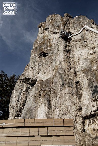 Ferdi Fischer test jump from a cherry picker crane about 15 meters into a half-built cardboard box catcher during setup at Burgsteinfelsen Dollnstein Bavaria