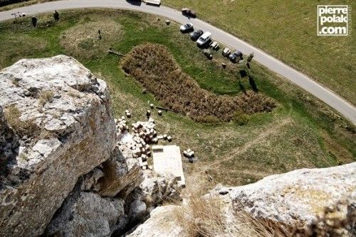 POV from the top of the Burgsteinfelsen looking down at the cardboard box catcher with tiny cars below showing the extreme 45 meter height in Dollnstein Bavaria