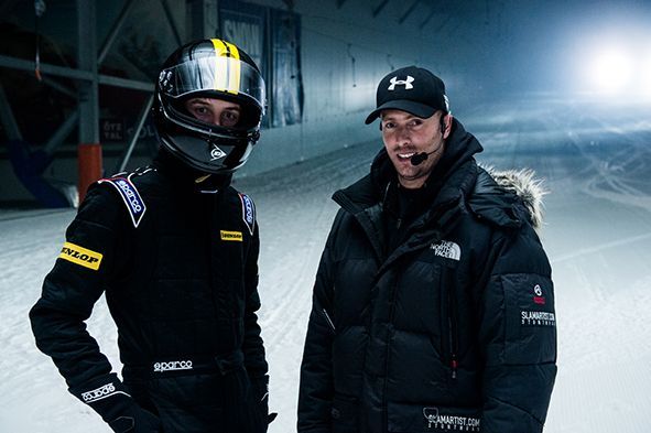 Action Director Ferdi Fischer and precision driver Daniel Leavitt standing in the Snow Dome in Bispingen, an indoor ski resort, on the set of a Dunlop commercial.
