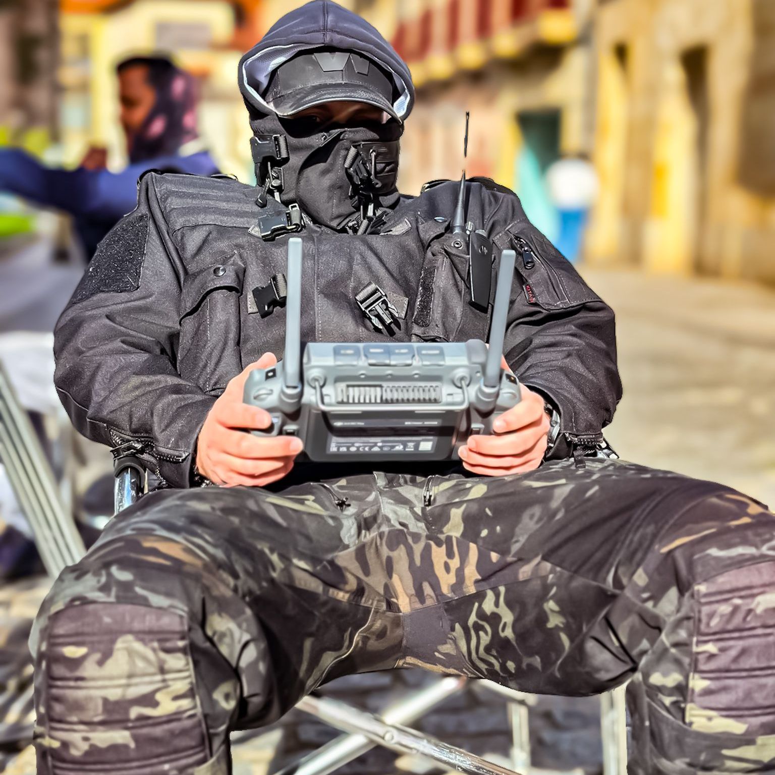 Action director and stunt coordinator Ferdi Fischer sitting in tactical gear operating the WarpCam on a freezing day during the Bollywood feature War 2, filmed on location in Spain.