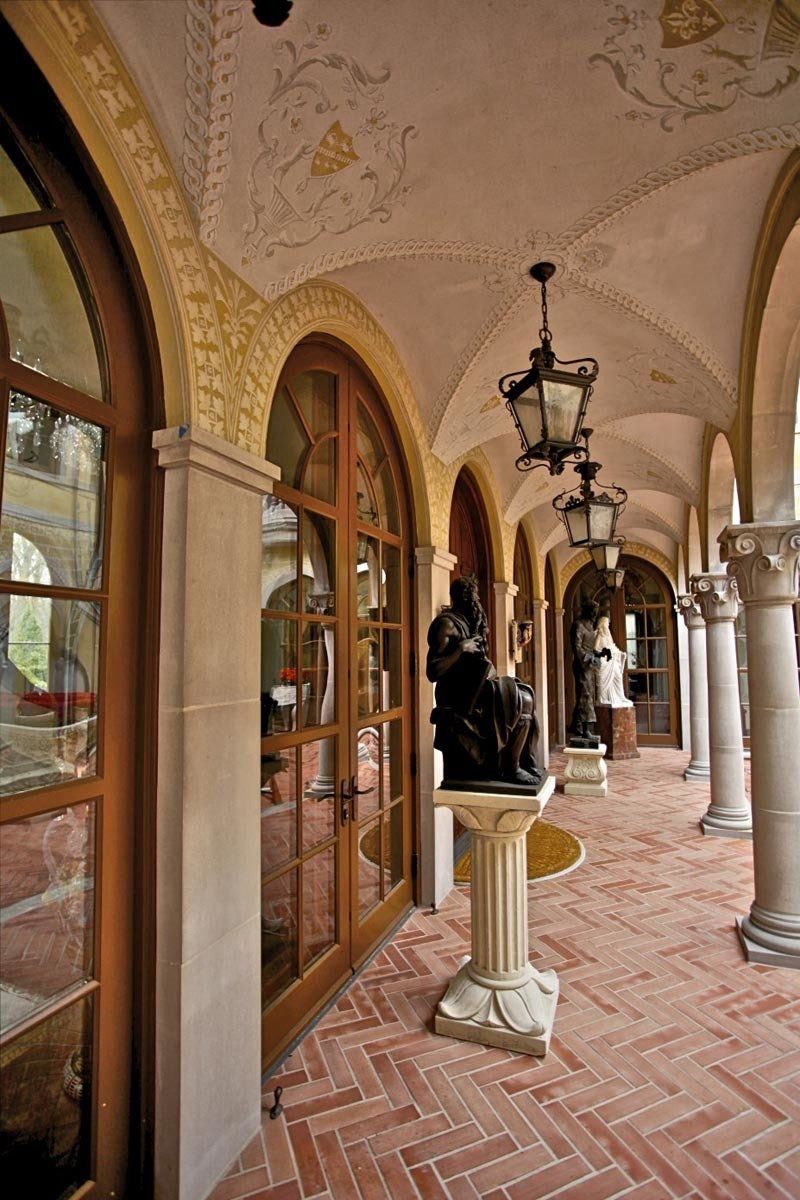 A very long hallway with arches and columns
