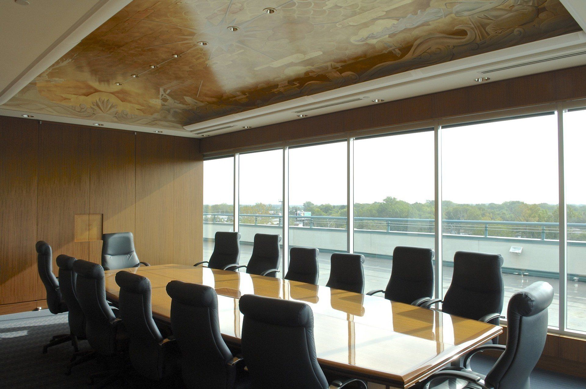 A conference room with a long table and chairs