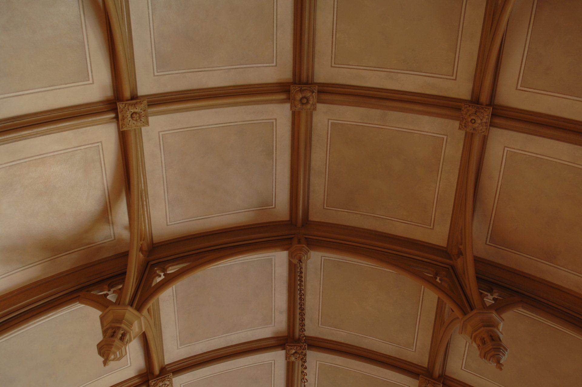 A close up of a wooden ceiling in a building.