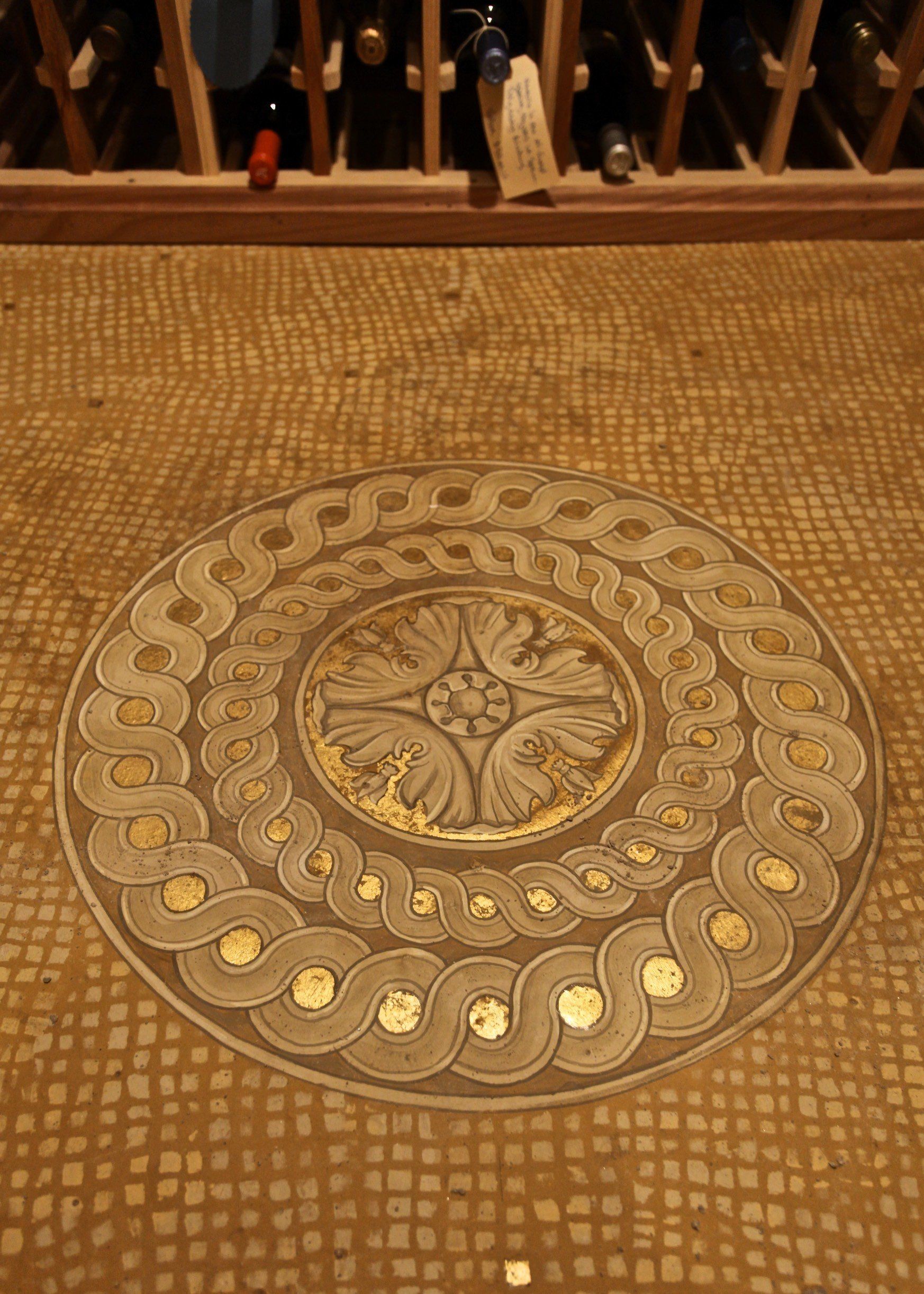 A wine cellar with a circular design on the floor.
