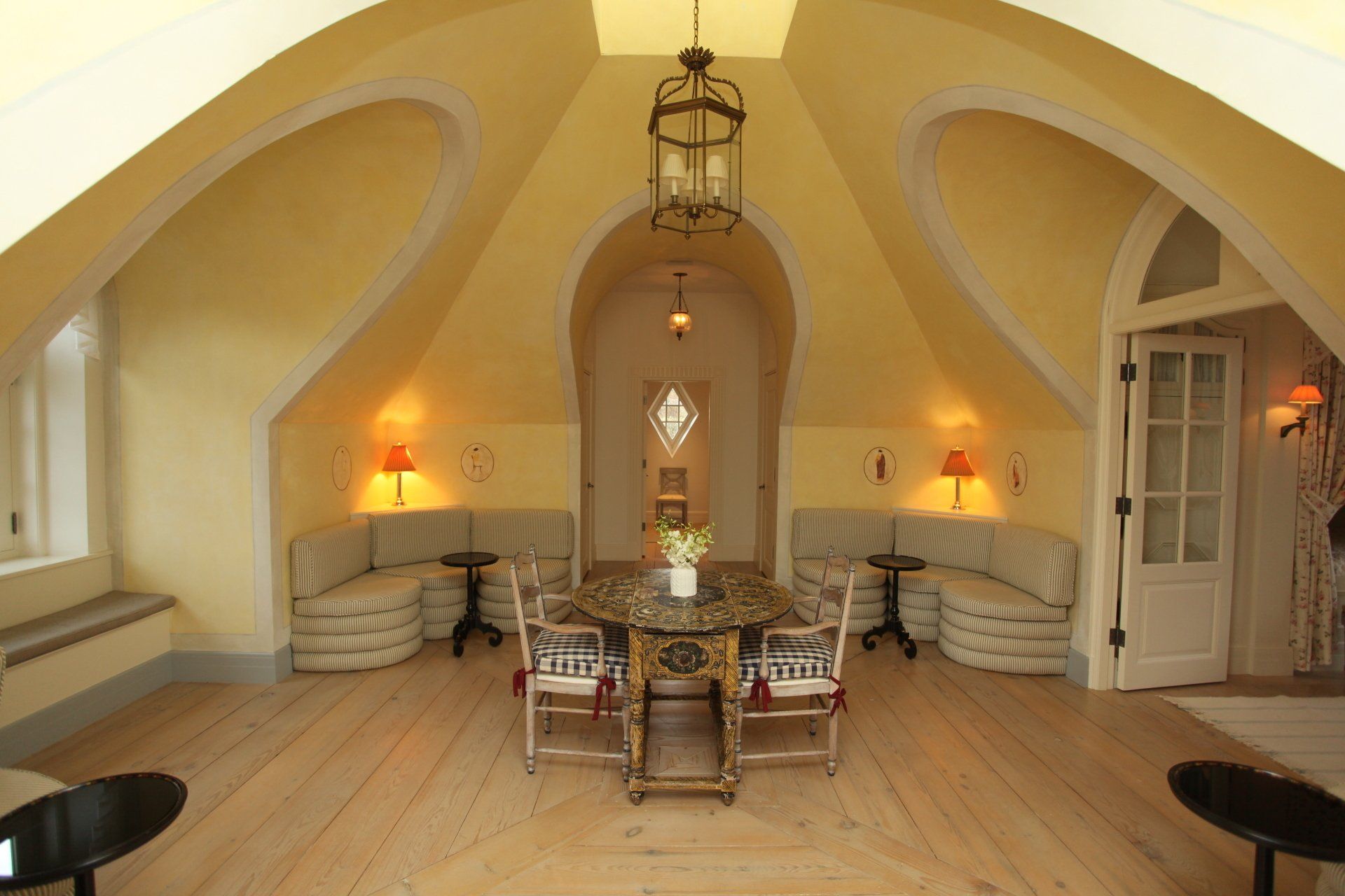 A room with a table and chairs in it