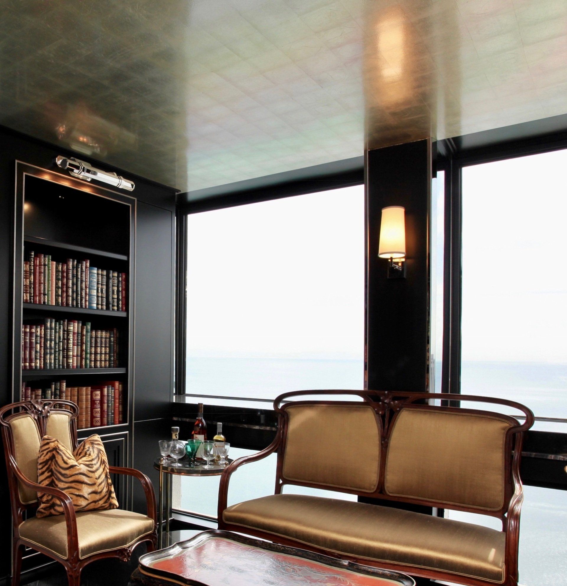 A living room with a couch a chair and a table