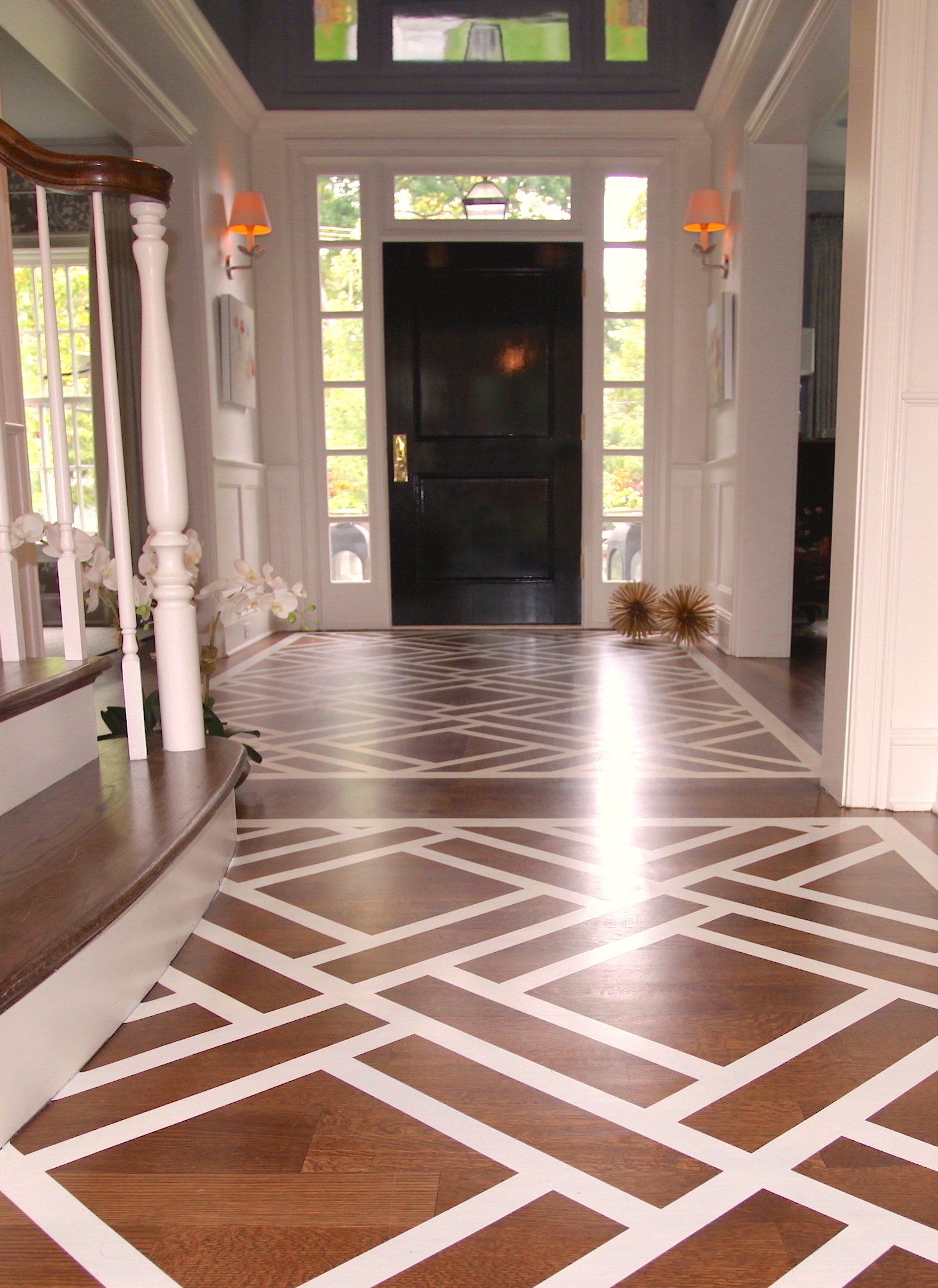 A hallway with a wooden floor and white stripes on it