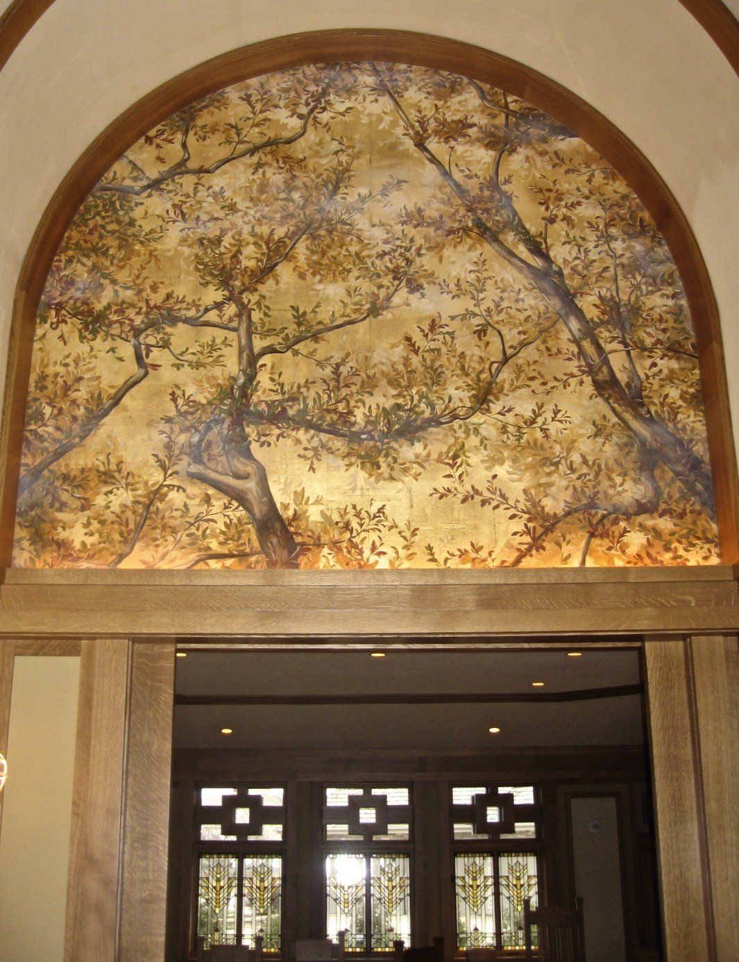 A doorway with a painting on the wall above it