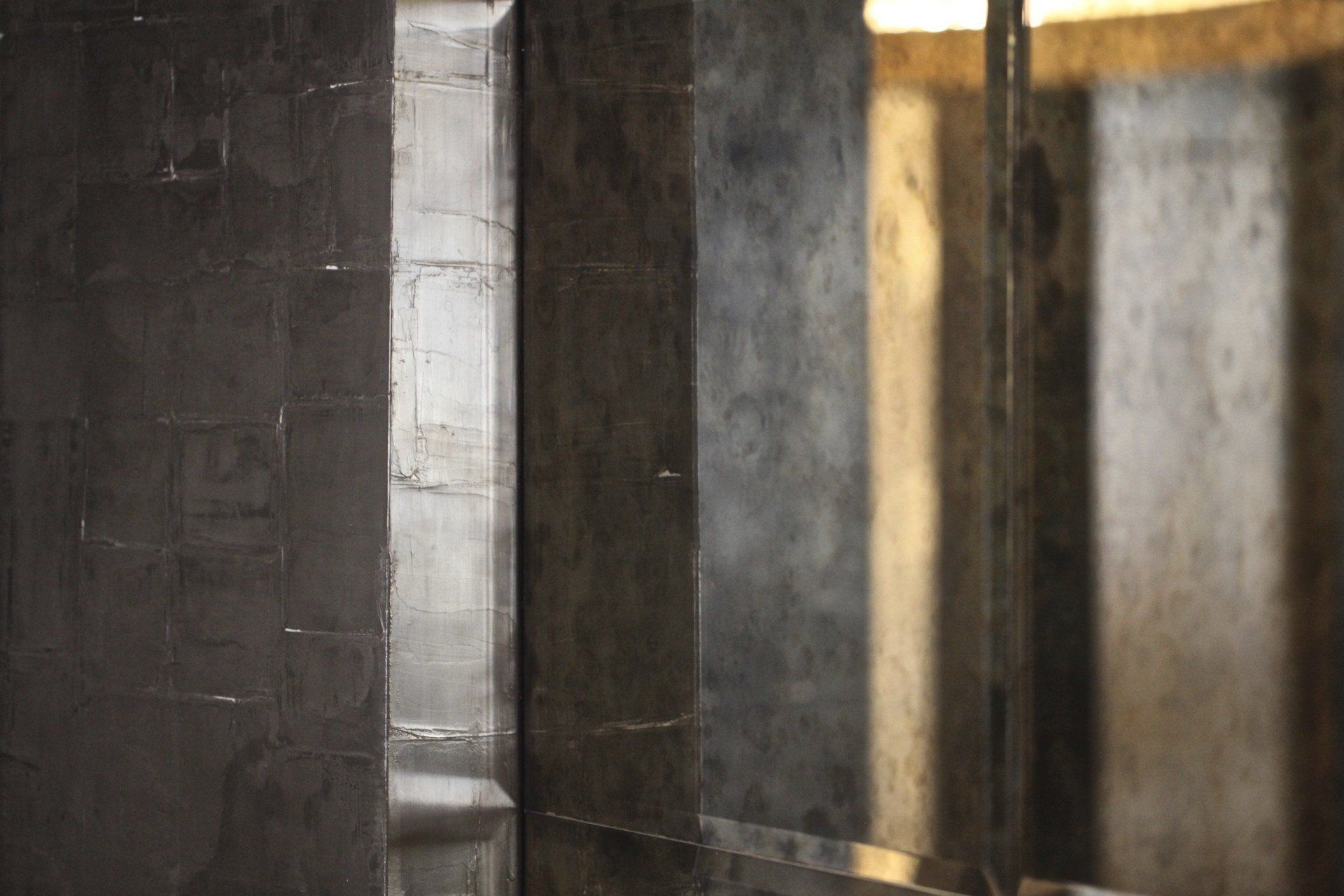 A room with a lot of mirrors on the wall.