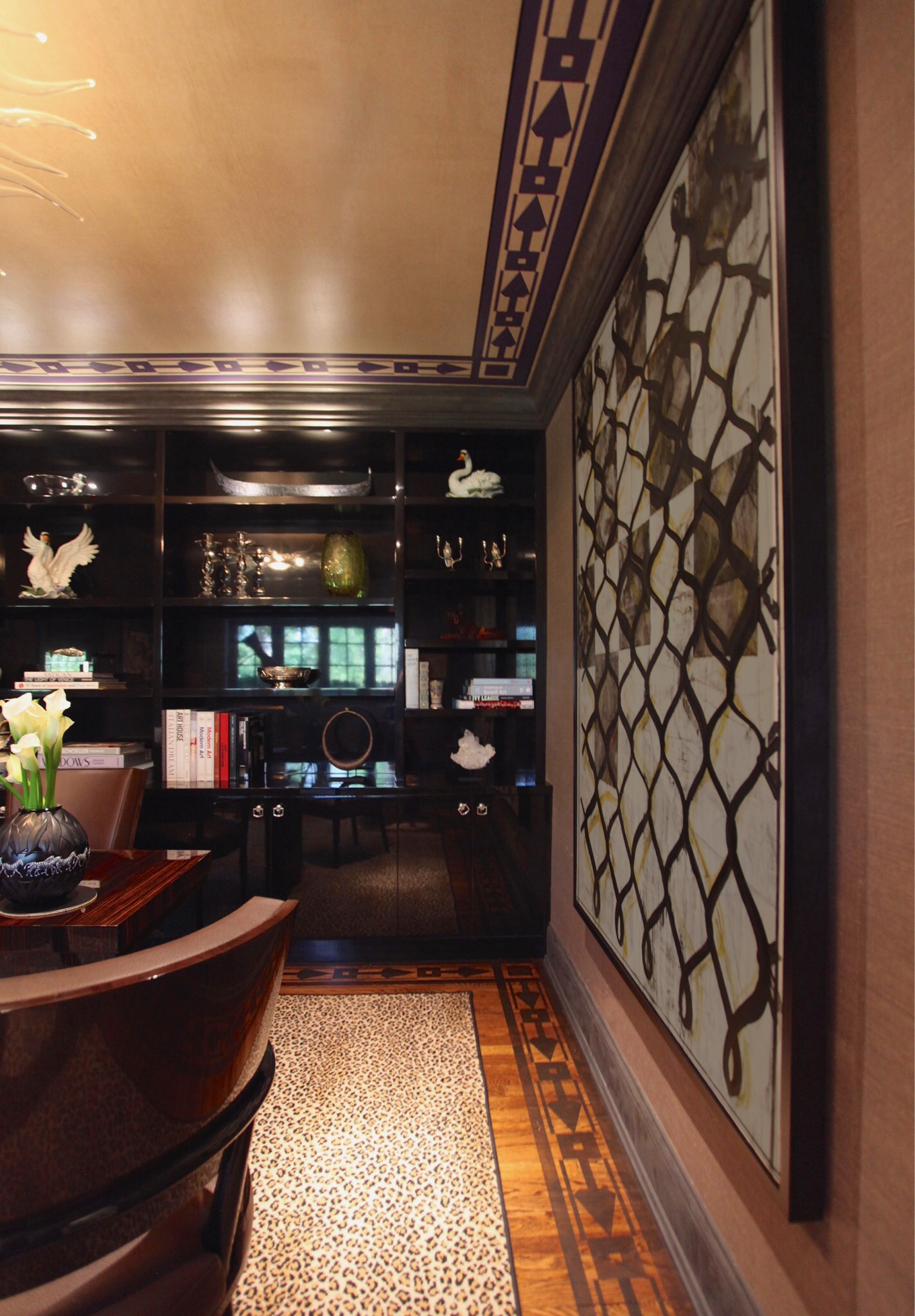 A living room with a large painting on the wall