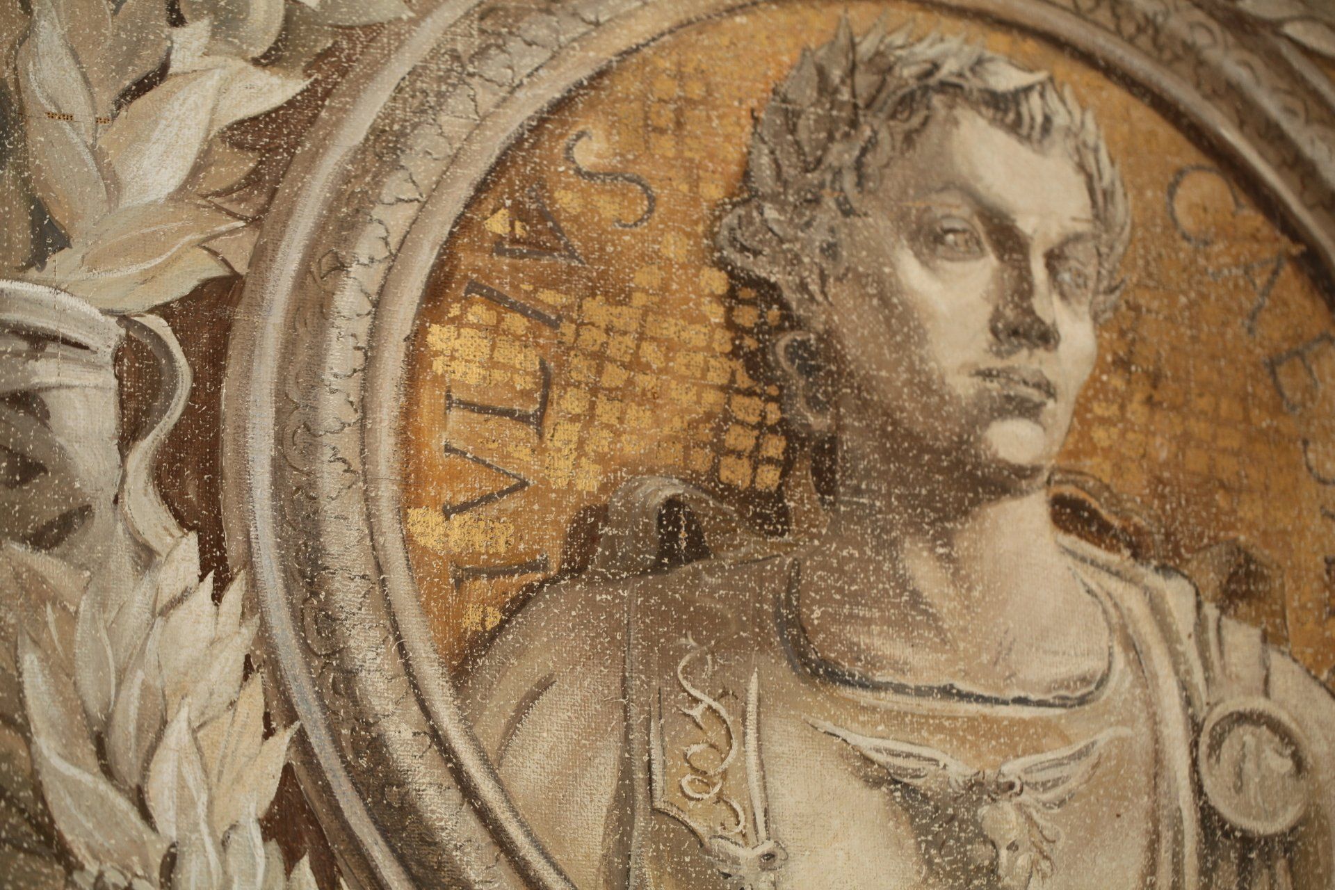 A statue of a man in a circle with the word vita on it