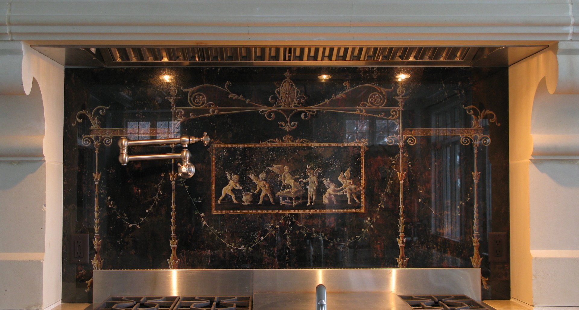 A kitchen with a black marble wall and stainless steel appliances