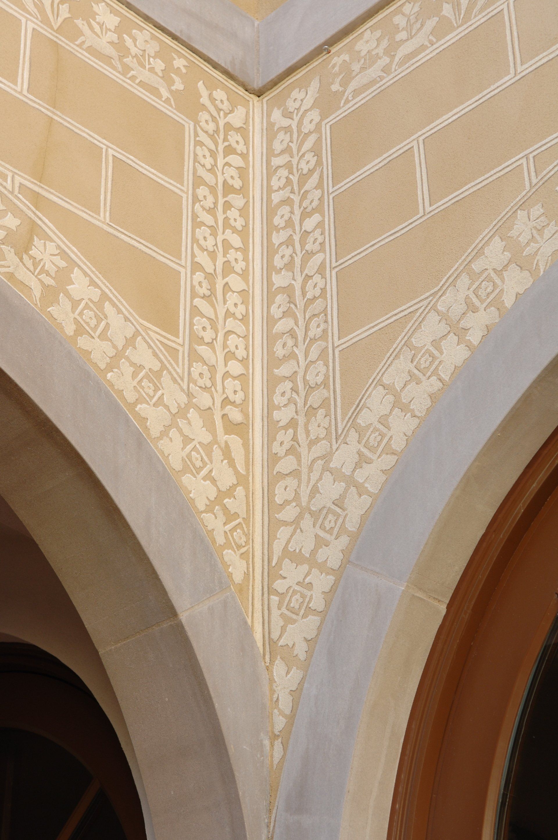 A close up of a corner of a building with arches.